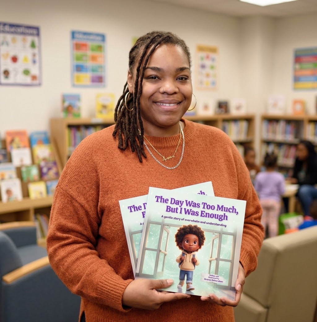 Sharon Richardson smiling and holding copies of The Day Was Too Much, But I Was Enough